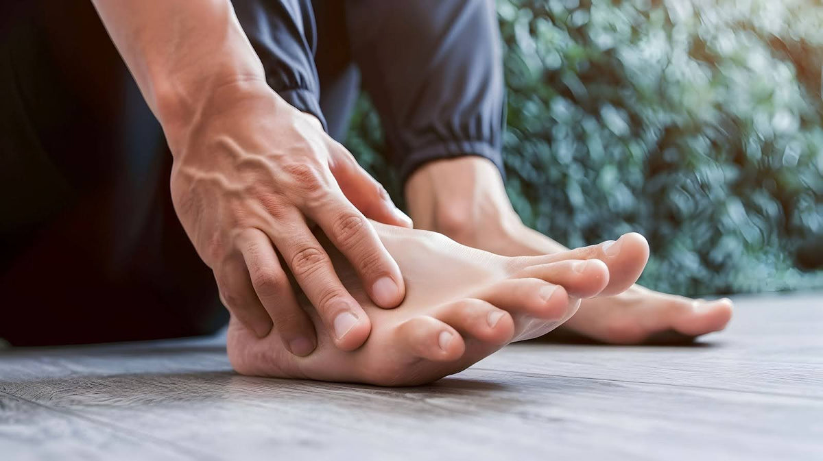 A man touching his feet.