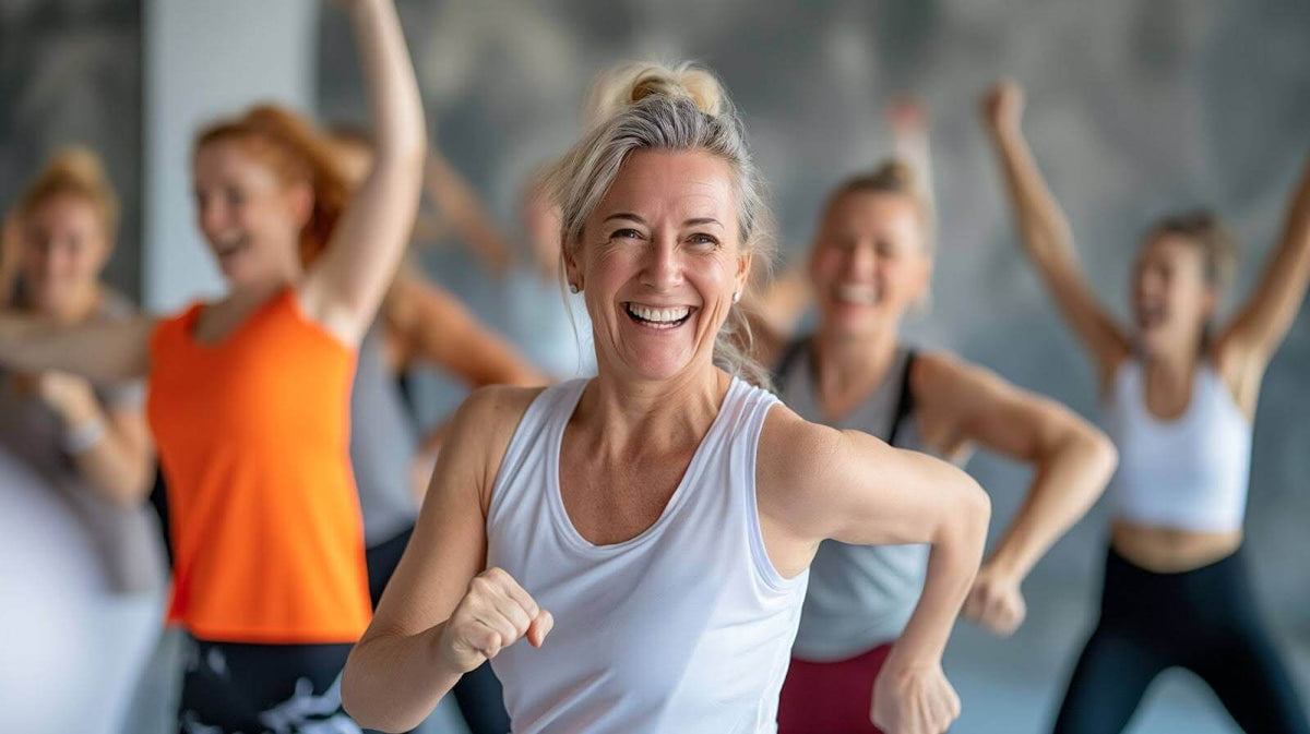 A woman smiling while exercising.