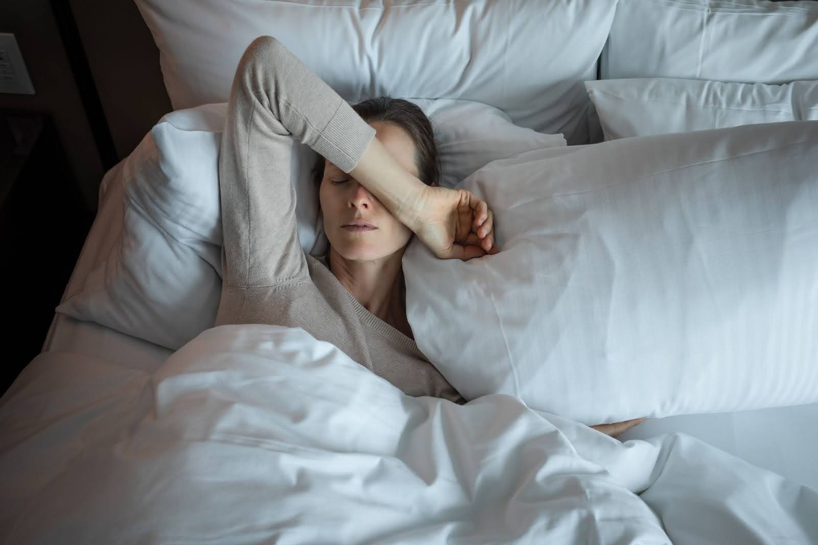 A woman in bed having trouble sleeping